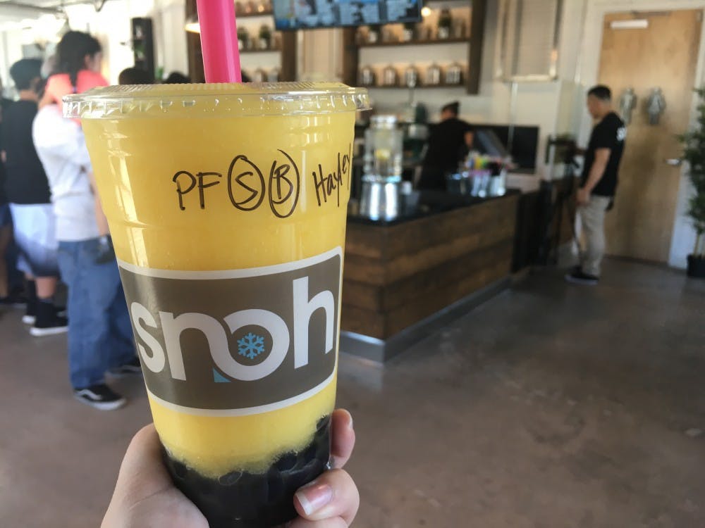 The passionfruit slushie&nbsp;with honey boba,&nbsp;photographed at Snoh Ice Shavery's grand opening on Sept. 24,&nbsp;is&nbsp;one of the drink combinations offered at the shop's new downtown Phoenix location. The business also serves milk teas, ice teas, as well as "snoh," which is a combination of ice cream and traditional shaved ice.