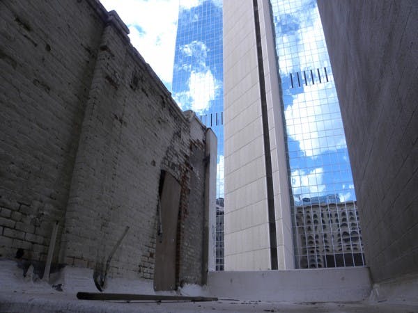 Clouds are reflected off the Chase Tower seen from an old neighboring building rooftop in downtown Phoenix on Thursday afternoon. (Photo by Tyler Griffin)