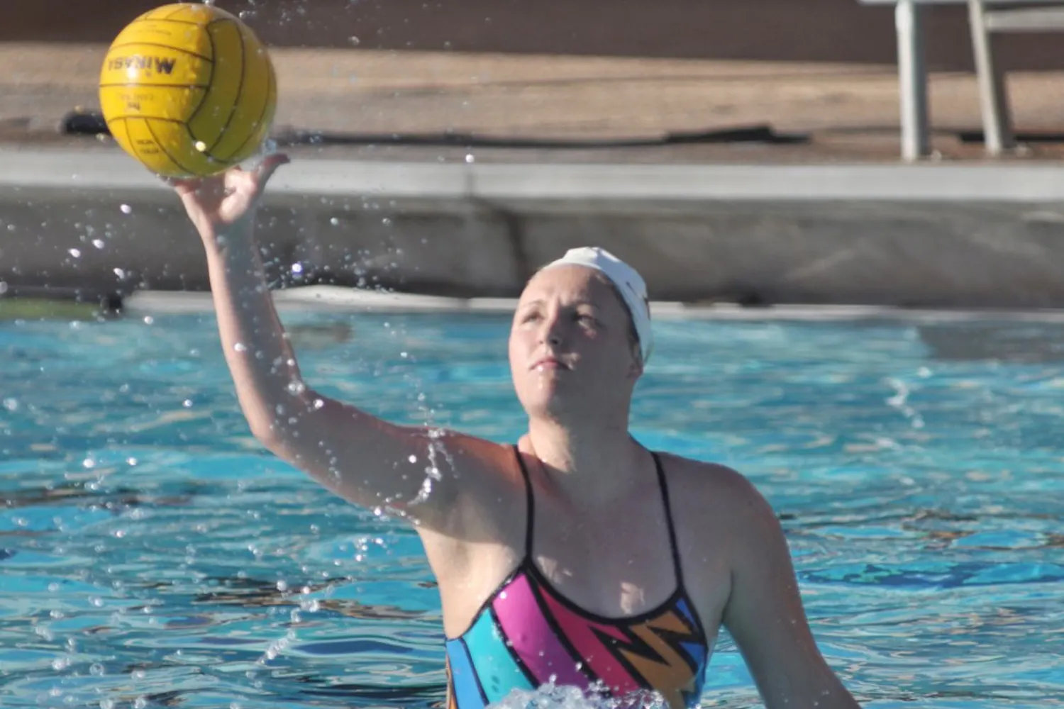 Lead woman: ASU freshman Paige Hacker receives a pass during practice on Feb. 24. Hacker is the first Arizonan to play for ASU, blazing a trail for water polo players in the state. (Photo by Sierra Smith)