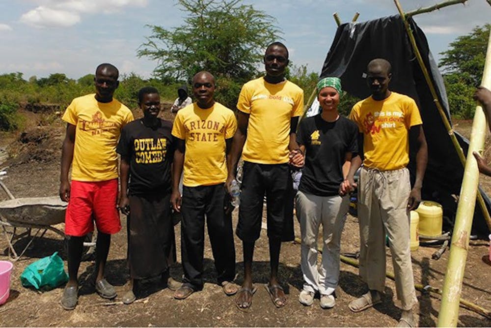 Brittany Duong, biomedical engineering senior and president of the ASU chapter of Engineers Without Borders, poses with Kenyan children on the group's annual trip to Kenya. (Photo Courtesy of Brittany Duong)