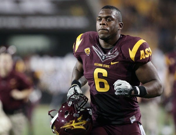 HONORED: Senior linebacker Shelly Lyons trots back to the Pat Tillman Tunnel after the first half of the Sun Devils’ 43-22 victory over USC. Lyons was named Pac-12 Defensive Player of the Week for his performance on Saturday. (Photo by Beth Easterbrook)