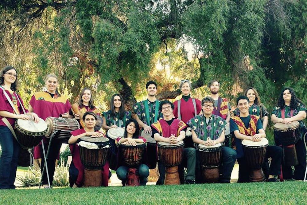 The African Drum Ensemble poses for a photo. &nbsp; 