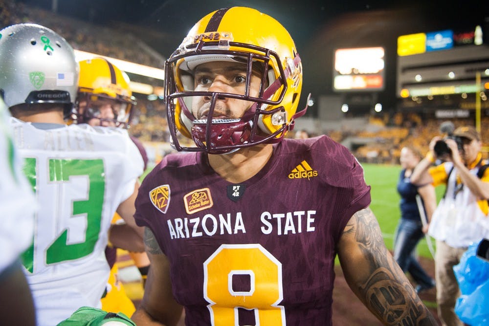 Senior wide receiver D.J. Foster (8) leaves the field before a game against Oregon on Thursday, Oct. 29, 2015, at Sun Devil Stadium in Tempe.
