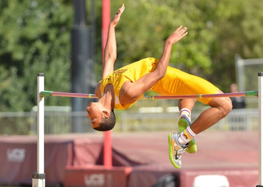 High marks: ASU freshman Bryan McBride arches over the bar during the high jump competition at the ASU Invitational on Saturday. McBride finished second in the high jump with a height of 2.1 meters. (Photo by Aaron Lavinsky)