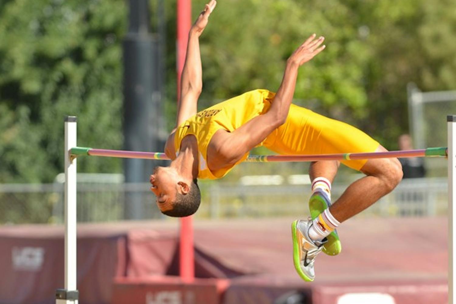 High marks: ASU freshman Bryan McBride arches over the bar during the high jump competition at the ASU Invitational on Saturday. McBride finished second in the high jump with a height of 2.1 meters. (Photo by Aaron Lavinsky)