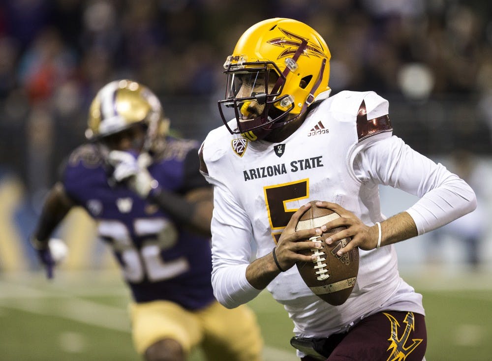ASU Sun Devils quarterback Manny Wilkins (5) runs the ball on a quarterback-keep play during a football game against the UW Huskies on Saturday, Nov. 19, 2016, in Husky Stadium in Seattle, Washington. 