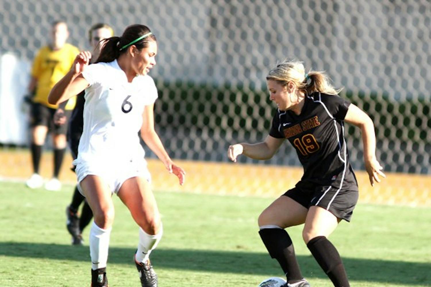 NOT ENOUGH: ASU senior defender Kari Shane tries to dribble past Cal sophomore midfielder Kaitlyn Fitzpatrick during the Golden Bears’ 1-0 win on Friday. The Sun Devils’ shortened roster was a major factor in the loss. (Photo courtesy of Steve Rodriguez)