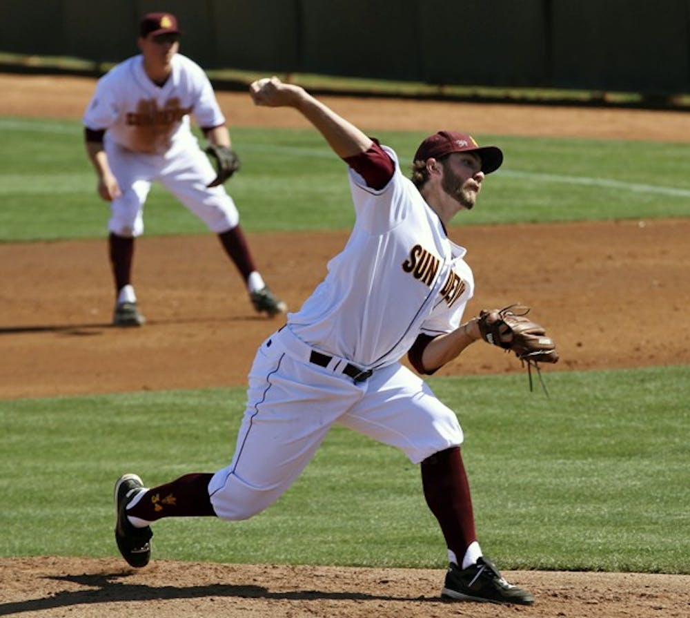 FROM HIS KNEES: Sophomore second baseman Zack MacPhee throws to second after making a diving stop last month against Houston. ASU won two of three in its road series against Oregon. (Photo by Scott Stuk)