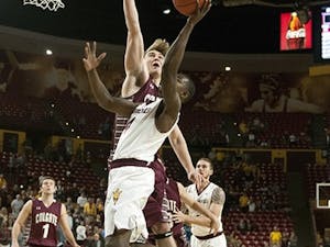 Junior guard Gerry Blakes attempts a lay up. ASU narrowly defeated Colgate, 78-71, at Wells Fargo Arena on Saturday, Nov. 29, 2014. (Photo by Mario Mendez)
