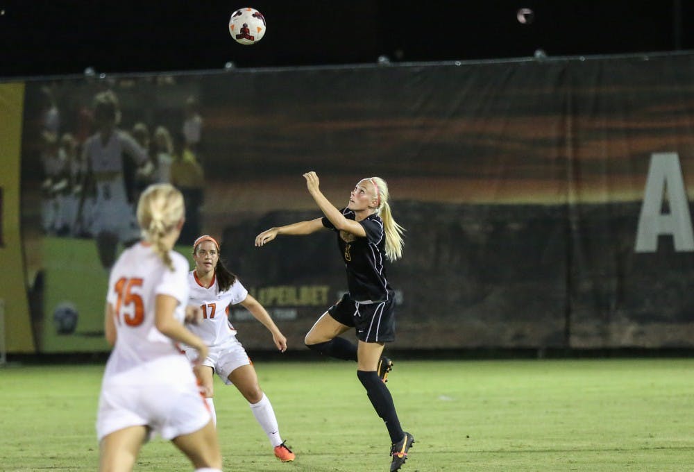 ASU sophomore McKenzie Berryhill jumps to head the ball. ASU won the game 4-3 in the Sun Devil Classic. (Photo by Arianna Grainey)