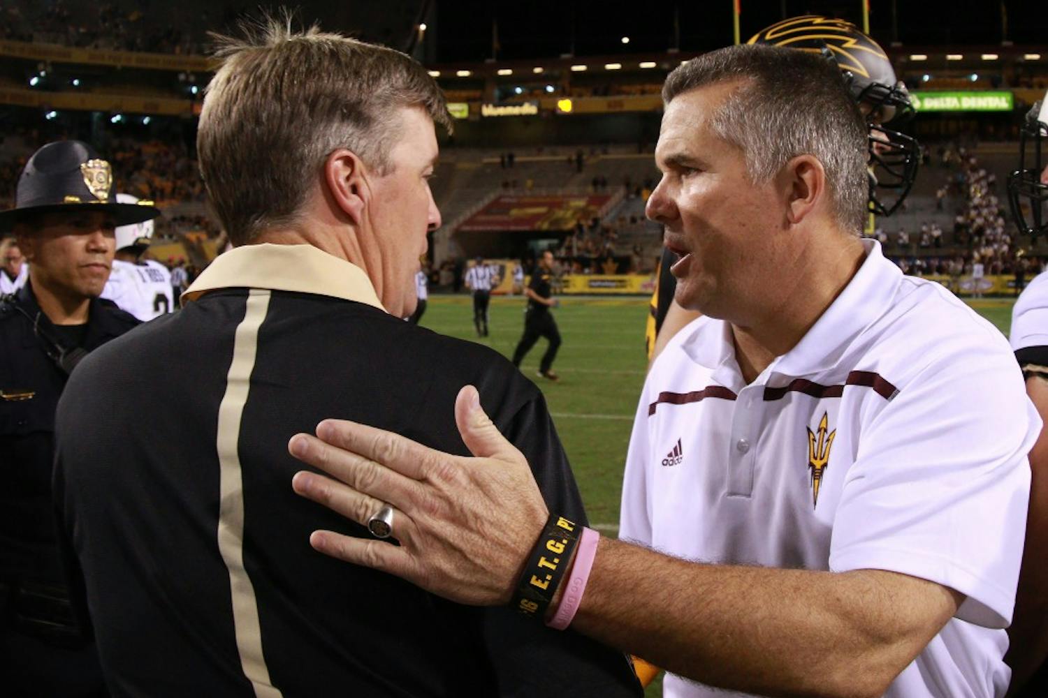 Head coach Todd Graham shakes hands with Colorado head coach Mike MacIntyre after the game against Colorado on Saturday, Oct. 10, 2015, at Sun Devil Stadium in Tempe. The Sun Devils defeated the Buffaloes 48-23.