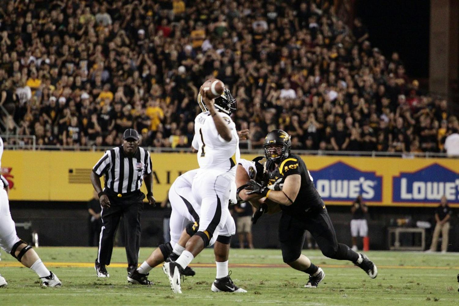 HEARTBREAKER: Missouri sophomore quarterback James Franklin makes a throw downfield during the Tigers' 37-30 overtime loss to ASU. The Tigers scored 14 fourth-quarter point to force OT. (Photo by Beth Easterbrook)