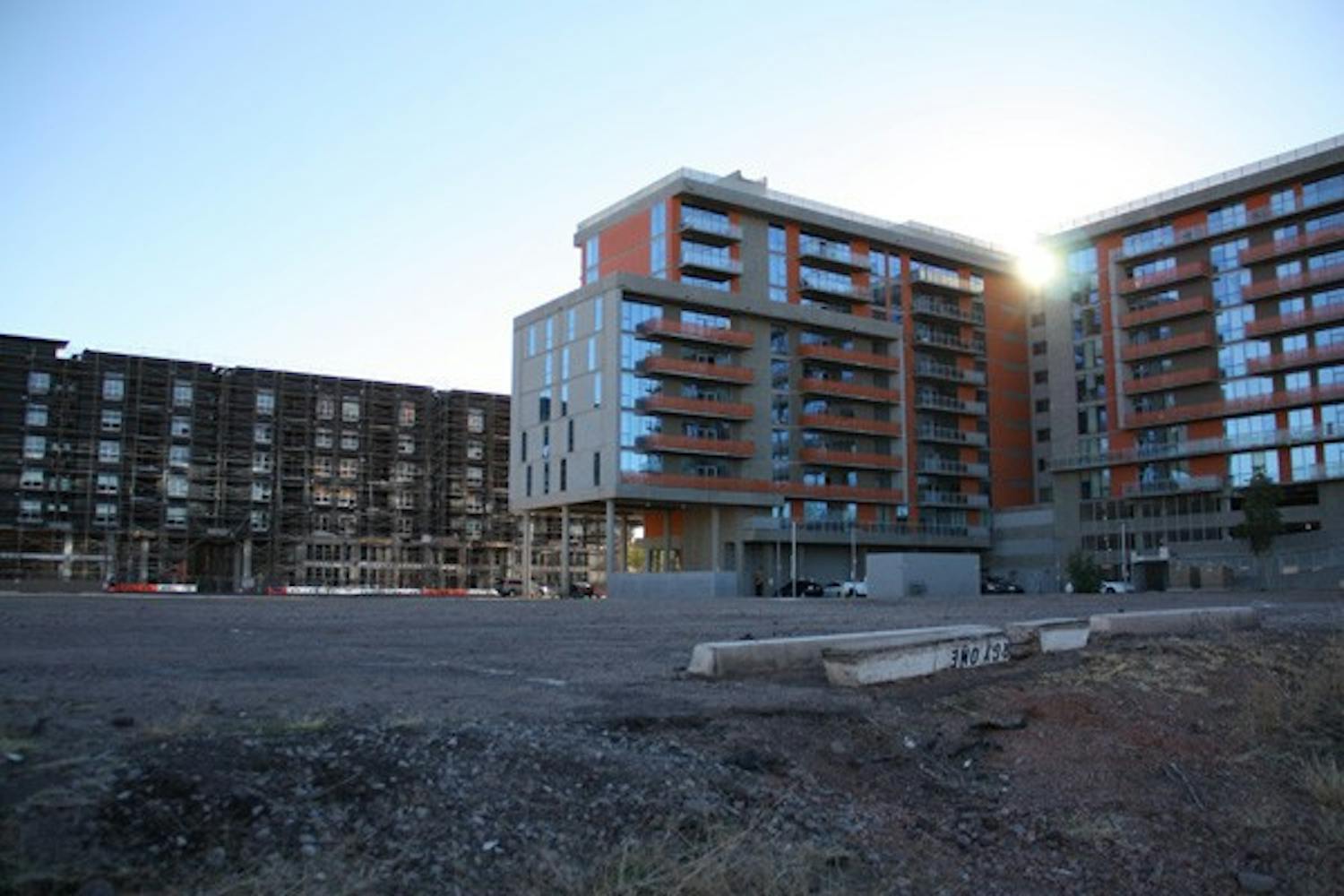 The Grove, expected to begin construction on the empty lot before 2014, has sparked controversy with the City of Tempe and surrounding neighborhoods as high-rise housing developments continue to increase near campus. (Photo by Shawn Raymundo) 