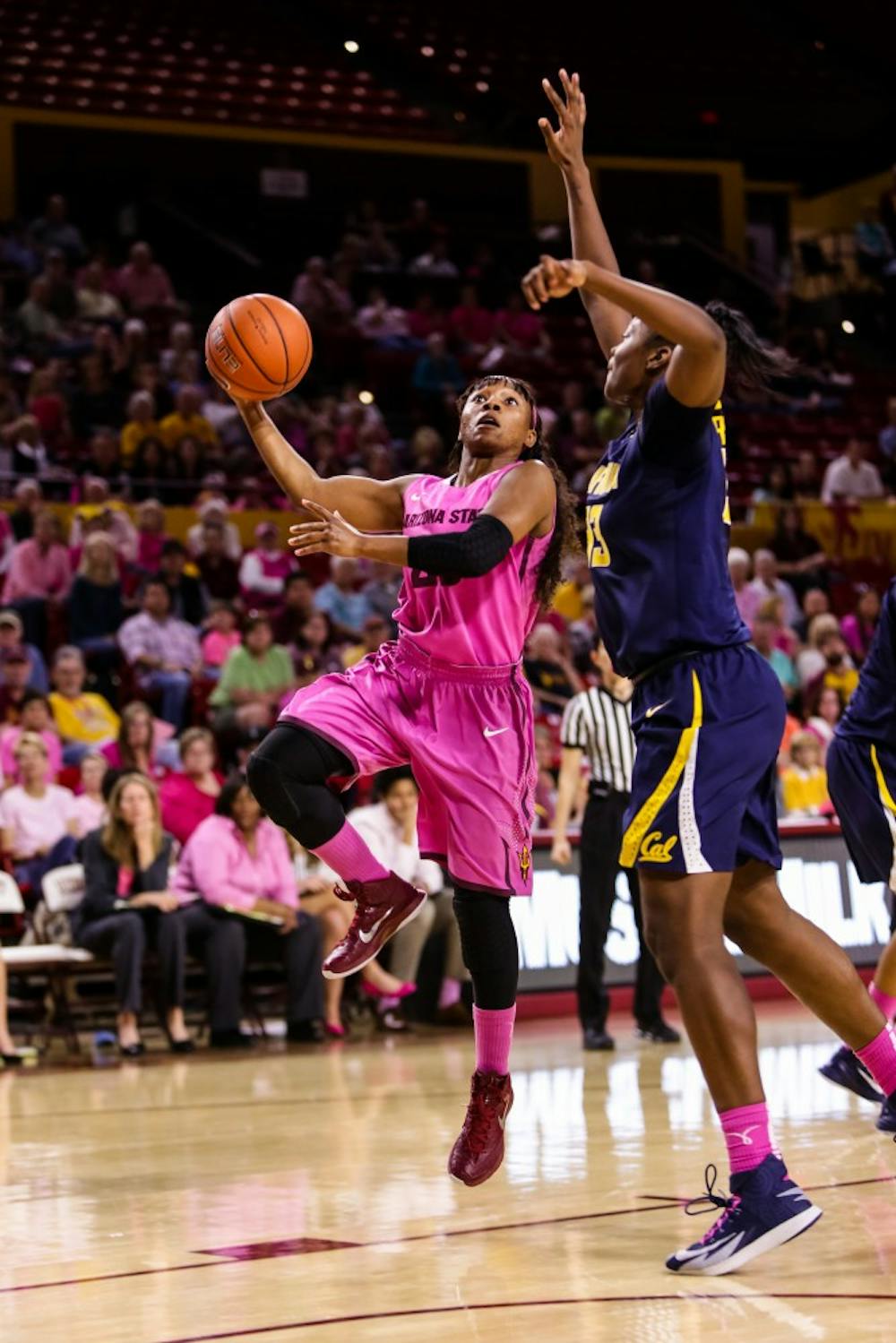 ASU junior guard Elisha Davis goes for a layup against Cal freshman guard Gabby Greene at the ASU
vs. Cal women’s basketball game at Wells Fargo Arena on Feb. 8, 2015. The Sun Devils would be stunned by a late shot by the Golden Bears losing 50-49. (Daniel Kwon/The State Press)