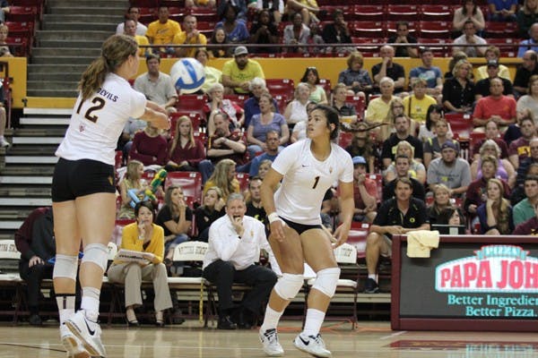 Freshman outside hitter Macey Gardner (12) bumps the ball to sophomore outside hitter Nora Tuioti-Mariner (1) during ASU’s 3-0 loss to No. 3 Oregon on Oct. 20. (Photo by Kyle Newman)