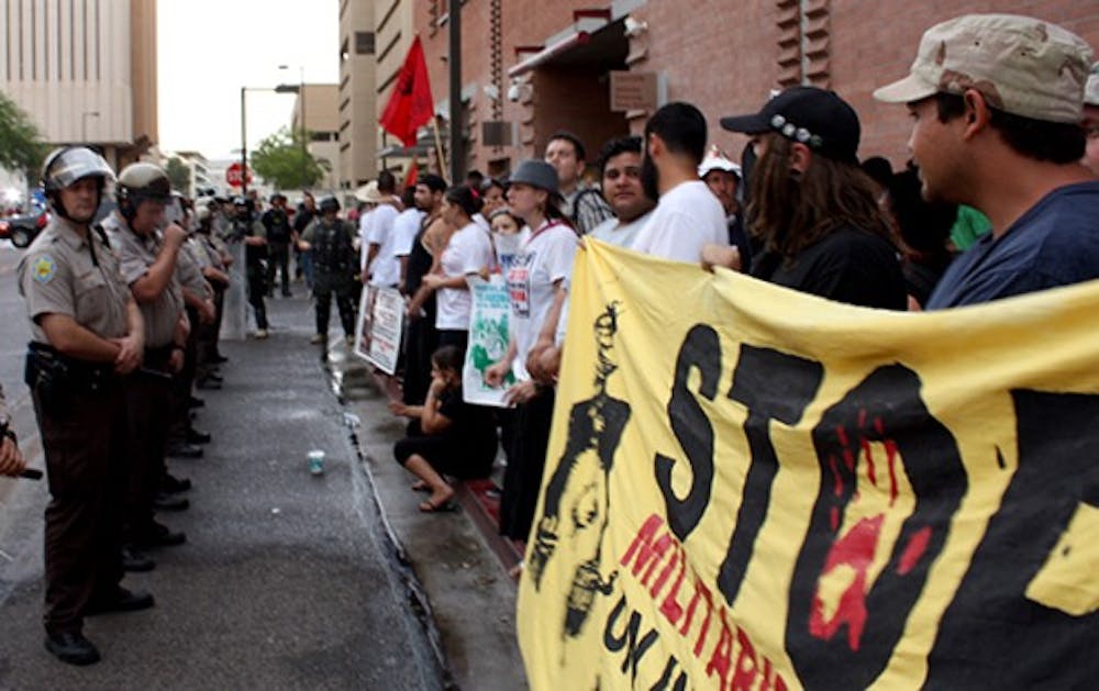 Protesters of the immigration bill SB1070 gather in downtown Phoenix Thursday afternoon. (Photo by Joe Schmidt)