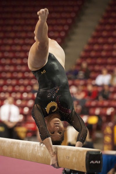 Kahoku Palafox performs a routine on the beams during the Sun Devils’ home meet against No. 4 Oklahoma on Jan. 12. ASU looks to rebound from its loss to the Sooners on the road vs. San Jose State and Sacramento State on Jan. 18. (Photo by Molly J Smith)