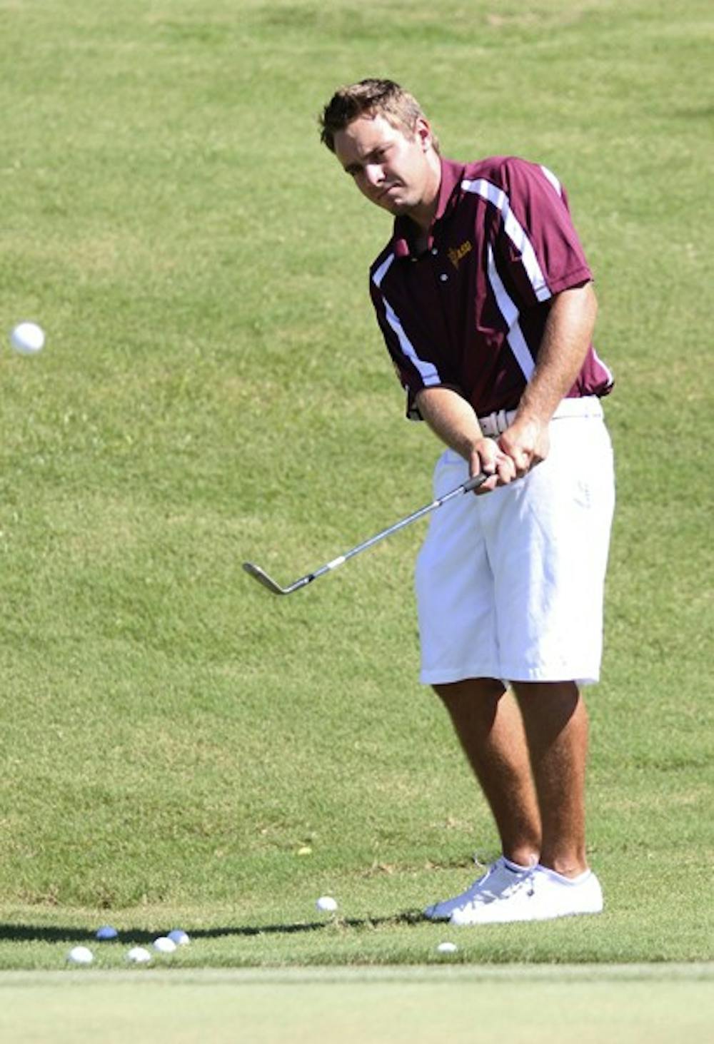 Sophomore Austin Quick chips away during an ASU golf practice. Quick knew after winning a tournament at Karsten in high school that he wanted to play golf at ASU. (Photo by Kyle Newman)