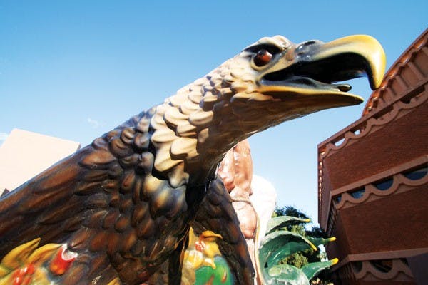 An angry eagle perches on the Southwest Pieta statue outside the ASU art museum. (Photo by Shelby Bernstein)
