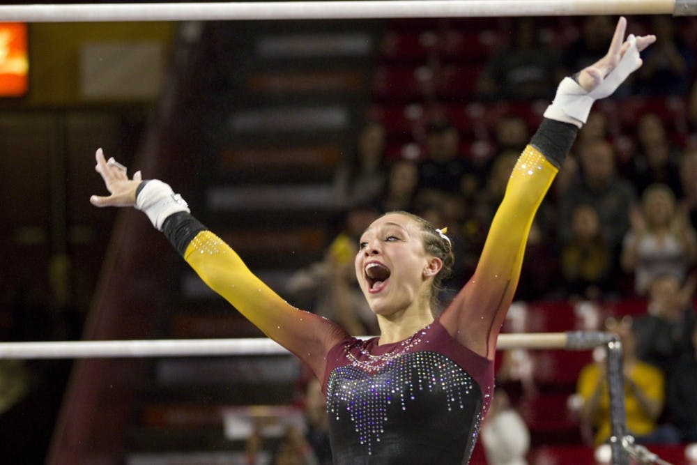 ASU freshman Ashley Szafranski celebrates after nailing her landing from the uneven bars during a gymnastics meet against the no. 5 ranked Utah Utes in Wells Fargo Arena in Tempe, Arizona on Saturday, Feb. 25, 2017. ASU lost the meet 197.600 to 194.850. (Josh Orcutt/State Press)