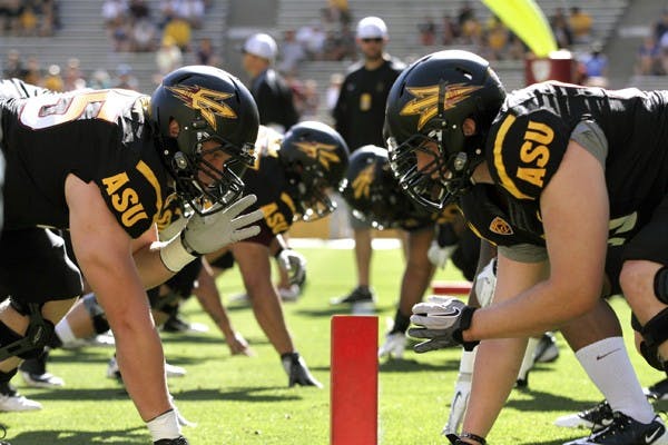 The Sun Devils warm up before the first spring scrimmage Saturday at Sun Devil Stadium. (Photo by Sam Rosenbaum)