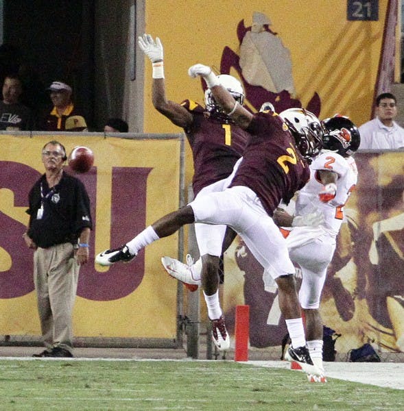 TALL ORDER: ASU corner backs Eddie Elder and Deveron Carr take down Oregon State junior wide receiver Markus Wheaton during the Sun Devils’ win over the Beavers on Sept. 1. Elder and Carr said defending against Oregon on Saturday will be tough, but the secondary is ready for the challenge. (Photo by Beth Easterbrook)