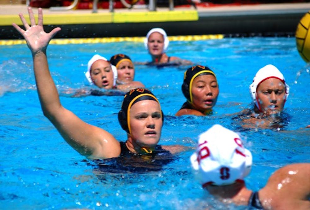 Redshirt senior attacker Alicia Brightwell keeps her eye on the ball while guarding a Stanford attacker on March 24. Despite being the No. 4 team in the country the ASU water polo team will not get a bid for the NCAA tournament. (Photo by Murphy Bannerman)