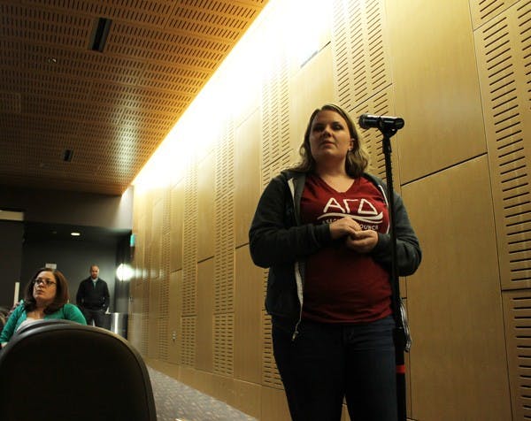 Casey Clowes, junior public service and public policy major, asks President Crow a question at Thursday's Q&A. (Photo by Laura Davis)