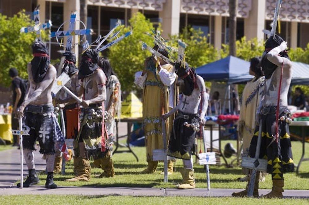 GOING NATIVE: Dancers perform at the Native American Festival on Hayden Lawn Monday afternoon. (Photo by Annie Wechter)
