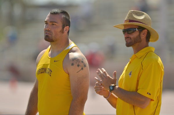 Gaining momentum: ASU redshirt sophomore Jordan Clarke talks to assistant coach Ryan Cole during the ASU Invite on March 26. The Sun Devils had another strong meet over the weekend, including a top-three sweep in the women’s 400-meter hurdles. (Photo by Aaron Lavinsky)