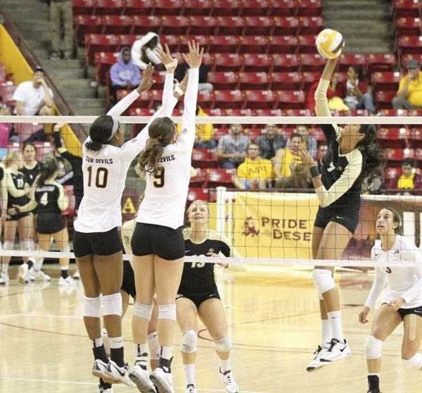 Senior middle blocker Erica Wilson (10) and sophomore outside hitter Kylee Terhune elevate to block a spike. The Sun Devil volleyball team begins its season Friday against Idaho State. (Photo by Sam Rosenbaum)
