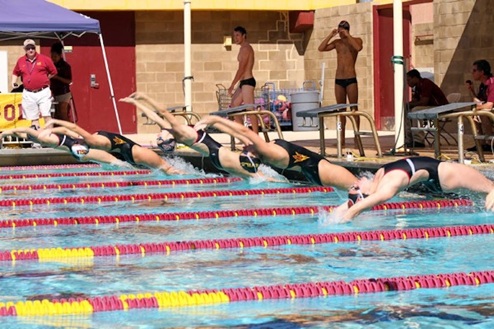 GOOD START: ASU and UNLV swimmers dive at the start of a backstroke race during the Sun Devils’ season opener against the Rebels on Saturday at the Mona Plummer Aquatic Complex. An ASU swimmer finished first in all the women’s events. (Photo courtesy of Maggie Emmons)