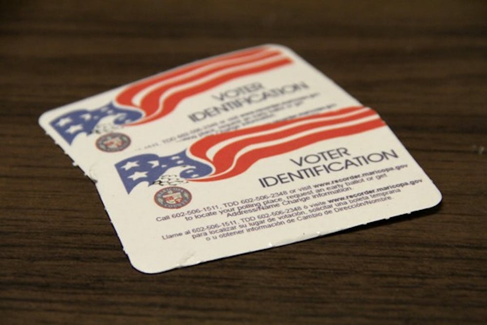 The U.S. Supreme Court is hearing a case challenging the constitutionality of an Arizona law that requires voters to present state identification when they register to vote and go to their polling place. Arizona's law requires all residents to show a photo ID card, two forms of non-photo ID or a photo ID with an inaccurate address and another identifier, like the pictured voter ID cards, when they vote. (Photo by Murphy Bannerman)