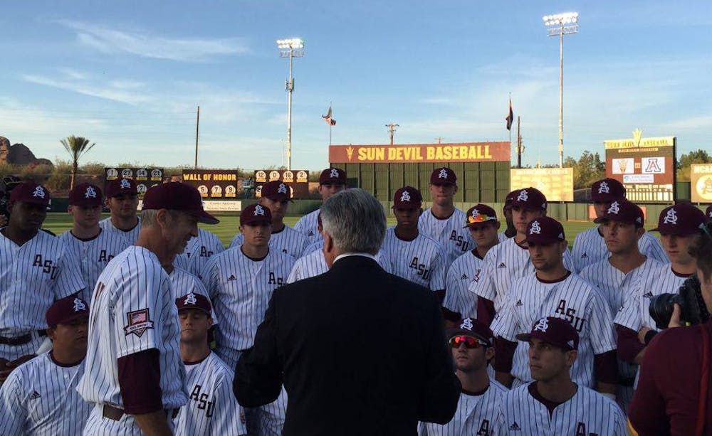 Rick Monday, in the suit, talks to the ASU baseball team prior to its game against Arizona on Tuesday, April 26, 2016 at Phoenix Municipal Stadium in Tempe, Arizona. The team was honoring Monday, an ASU alumnus, for the 40-year anniversary of him saving a flag that was being burnt in protest at Dodger Stadium.