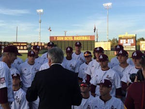 Rick Monday, in the suit, talks to the ASU baseball team prior to its game against Arizona on Tuesday, April 26, 2016 at Phoenix Municipal Stadium in Tempe, Arizona. The team was honoring Monday, an ASU alumnus, for the 40-year anniversary of him saving a flag that was being burnt in protest at Dodger Stadium.