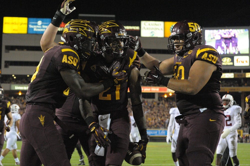 Redshirt junior receiver Jaelen Strong (center) celebrates after catching a touchdown pass against Stanford, Saturday, Oct. 18, 2014 at Sun Devil Stadium in Tempe. The Sun Devils beat the Cardinal, 26-10.