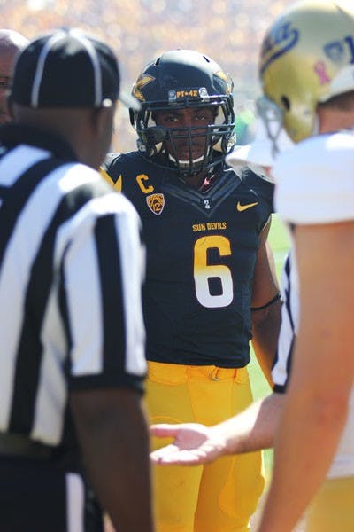 Senior running back Cameron Marshall observes the coin toss prior to the Sun Devils’ game against UCLA on Oct. 27. (Photo by Kyle Newman)