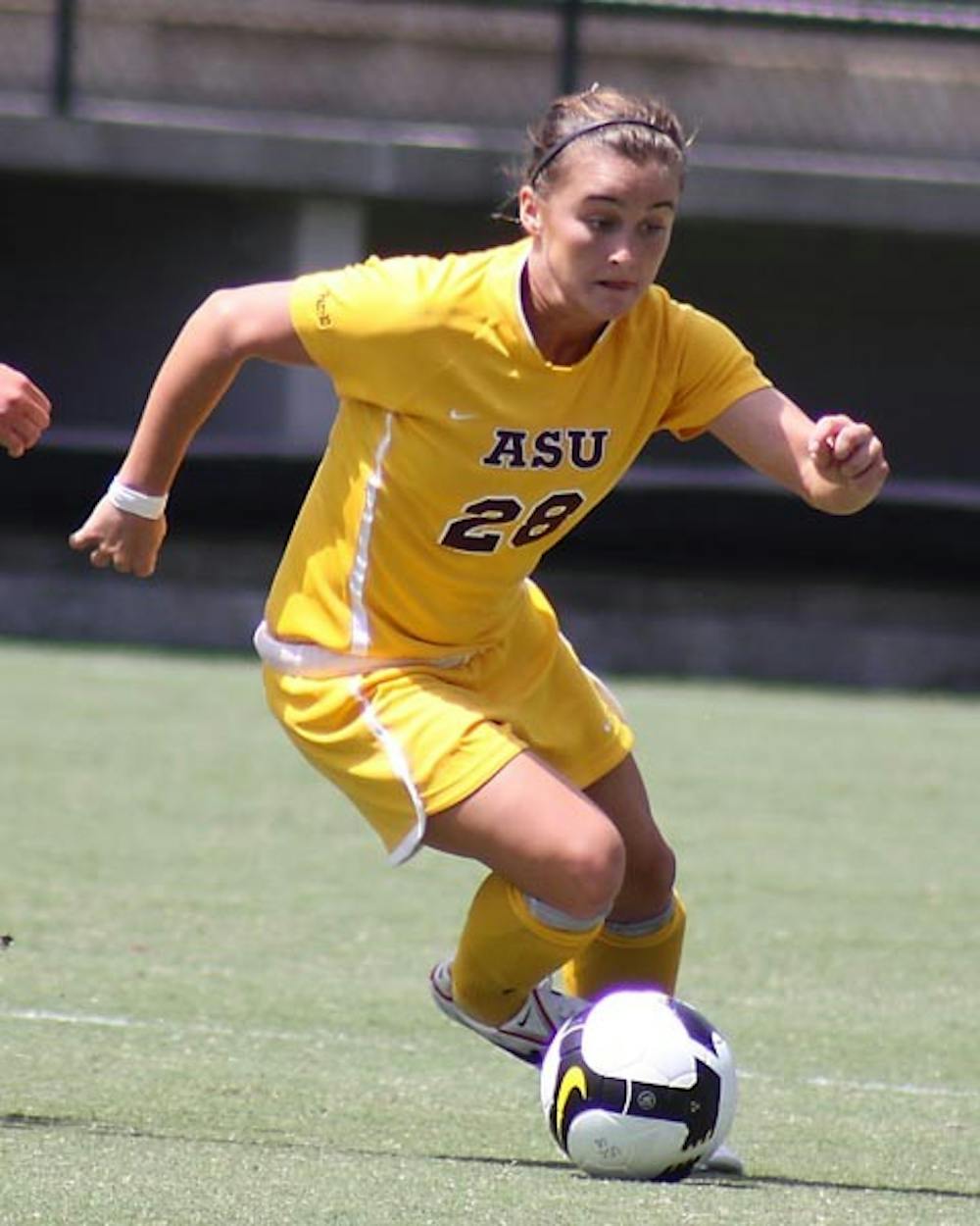SHUT OUT: Sophomore midfielder Taylor McCarter drives past defenders during a game earlier this season. ASU was held scoreless over the weekend, losing to Long Beach State and drawing with Pepperdine. (Photo by Steve Rodriguez, ASU Media Realtions)