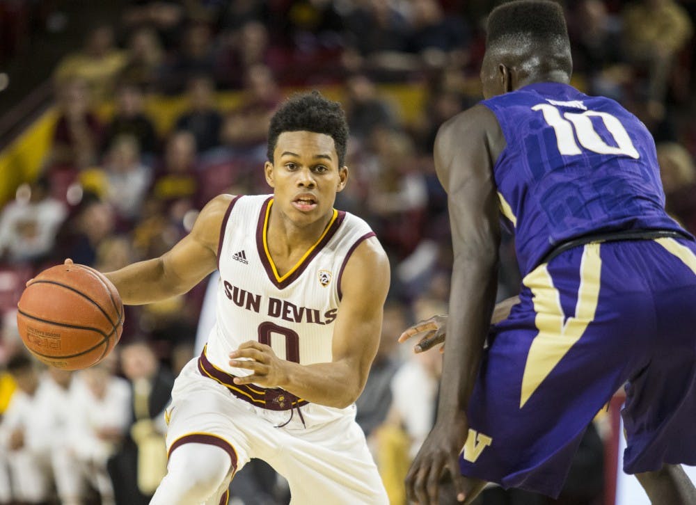 Arizona State Sun Devils guard Tra Holder (0) looks for an opening in the Husky defense during a game against the University of Washington Huskies in Wells Fargo Arena on Saturday, Jan. 16, 2015, in Tempe, Ariz. The Huskies won the matchup, 89-85.