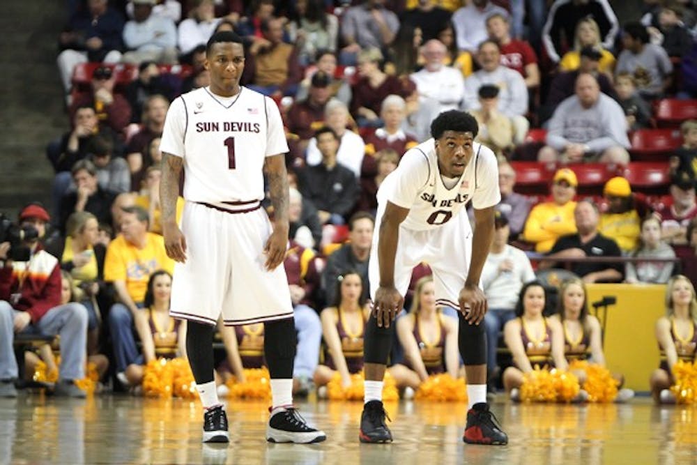 Carson and Felix catch a breath during a break in the action against Stanford on Feb. 10. (Photo by Samuel Rosenbaum)