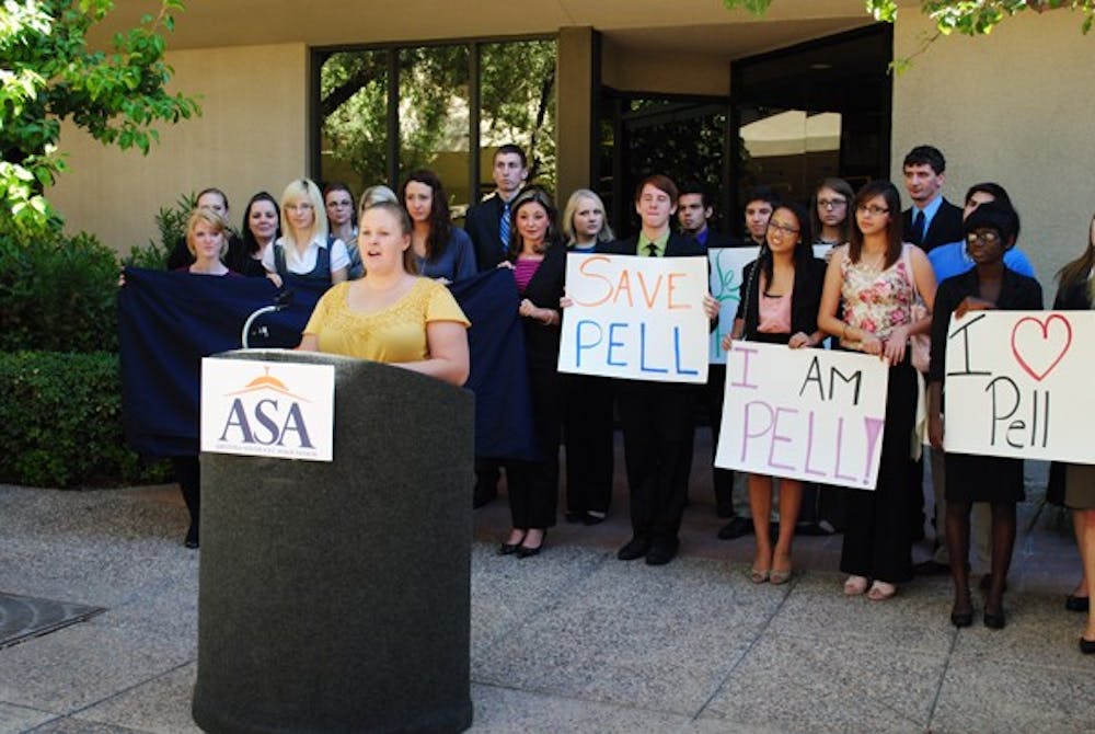SAVE PELL: Rhian Stotts, Vice President of the Graduate and Professional Students Association at ASU, advocates the need for the continued funding of Pell Grants and other federal financial aid programs Wednesday afternoon outside of U.S. Senator Jon Kyl's Phoenix office. (Photo by Caitlin Cruz)