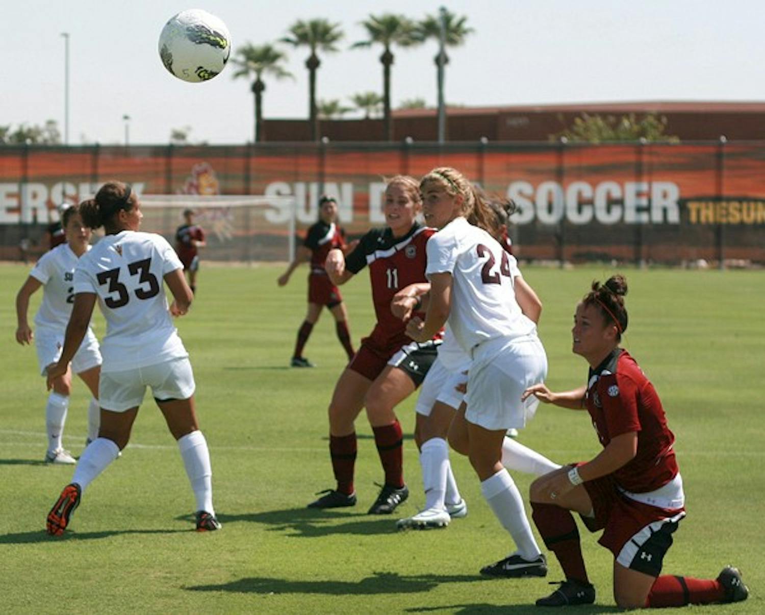 OPEN FIELD: ASU sophomore defender Kaitlyn Pavlovich (24) tracks the ball along with two South Carolina defenders during the Sun Devils’ close 1-0 win over the Gamecocks on Sunday. Pavlovich and the rest of the team travel to Virginia to take on the Cavaliers on Friday. (Photo by Michaela Mader)