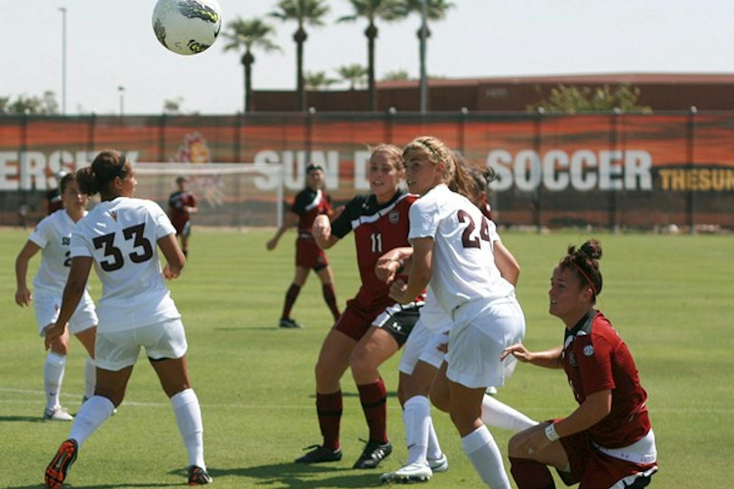 OPEN FIELD: ASU sophomore defender Kaitlyn Pavlovich (24) tracks the ball along with two South Carolina defenders during the Sun Devils’ close 1-0 win over the Gamecocks on Sunday. Pavlovich and the rest of the team travel to Virginia to take on the Cavaliers on Friday. (Photo by Michaela Mader)