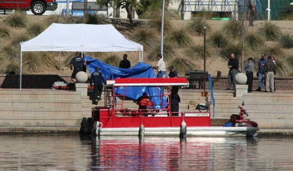 TRAGIC DISCOVERY: The Tempe Fire Department pulled the body of Willie Jigba out of the northeast end of Tempe Town Lake on Friday morning. Jigba, 24, was last seen leaving a Tempe house party on Jan. 16. (Photo by Lisa Bartoli)