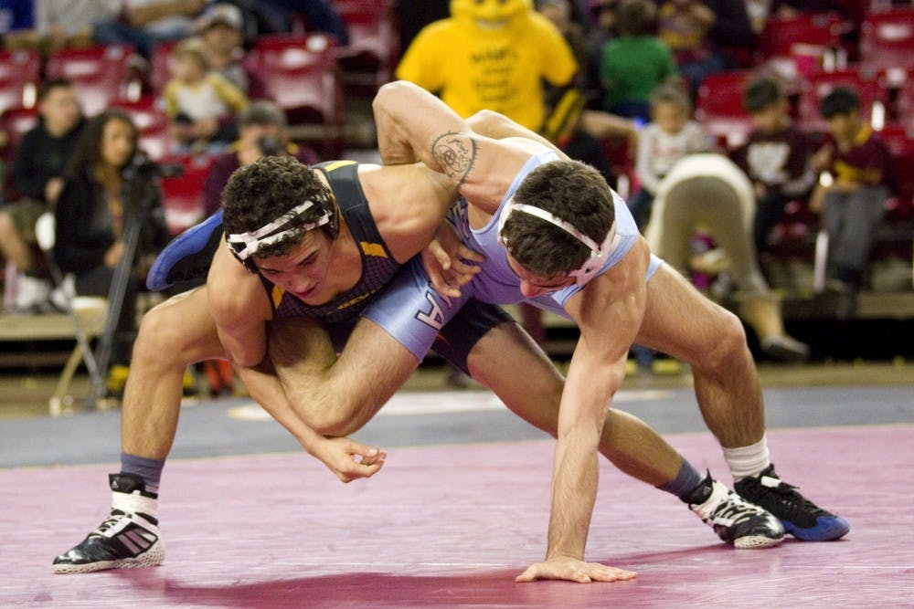 ASU's Ted Rico takes control over North Carolina's Nicholas Lirette during the wrestling meet versus North Carolina in Tempe, Arizona on Friday, Jan. 20, 2017. ASU won the meet 31-9, and Rico won 5-4.