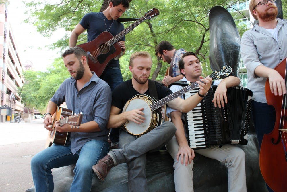 Local band Jared and the Mill rehearse before their live acoustic performance at Handlebar on Mill. The band took the stage Sunday night for Jared & The Mill’s listening party of “Western Expansion,” the group's first album set to releaseSept. 17. (Photo by Kelly Kleber)