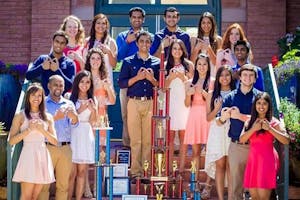 Andaaz, a Bollywood fusion dance team that incorporates various dance genres, poes for a photo with awards they have won. 