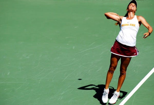 Senior Jacqueline Cako serves the ball during ASU's home meet vs. UCLA on April 6. The Sun Devils are currently riding a four-game losing streak after winning 15 of their first 16 regular season matches. (Photo by Murphy Bannerman)