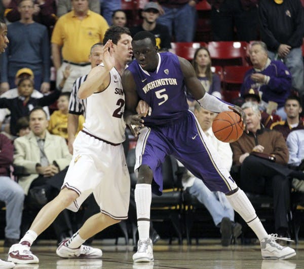 Washington forward Aziz N’Diaye (right) backs down Ruslan Pateev (left) in a game against ASU on Jan. 26. The Huskies are one of the most talented teams in the Pac-12. (Photo by Sam Rosenbaum)