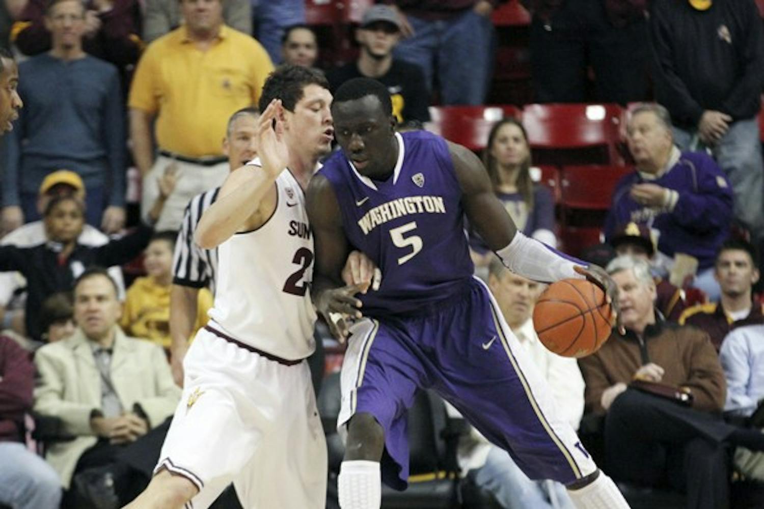 Washington forward Aziz N’Diaye (right) backs down Ruslan Pateev (left) in a game against ASU on Jan. 26. The Huskies are one of the most talented teams in the Pac-12. (Photo by Sam Rosenbaum)